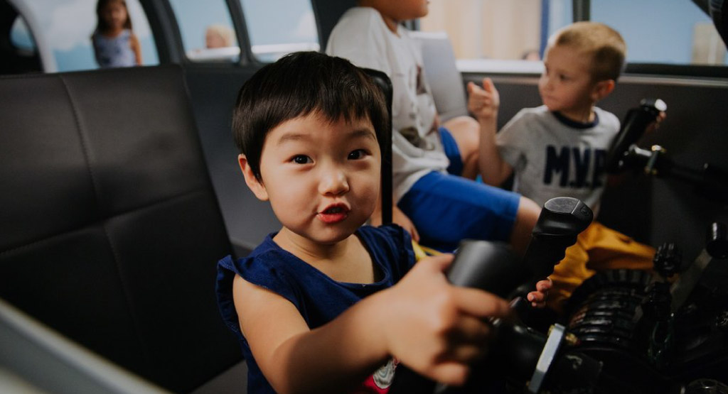 Children play in the Explore More Museum's plane exhibit