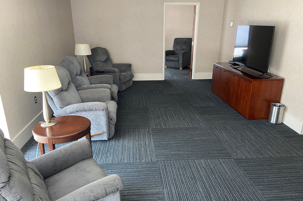 SHD's private pilot's lounge with comfy chairs and a TV
