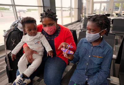 Tisha McCoy-Ntiamoah and her child at Shenandoah Valley Airport